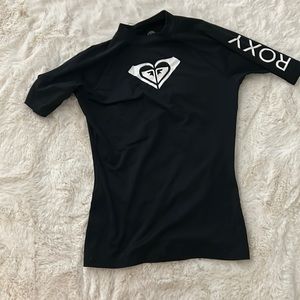 Black Roxy swimwear shirt, little cracks in the logos